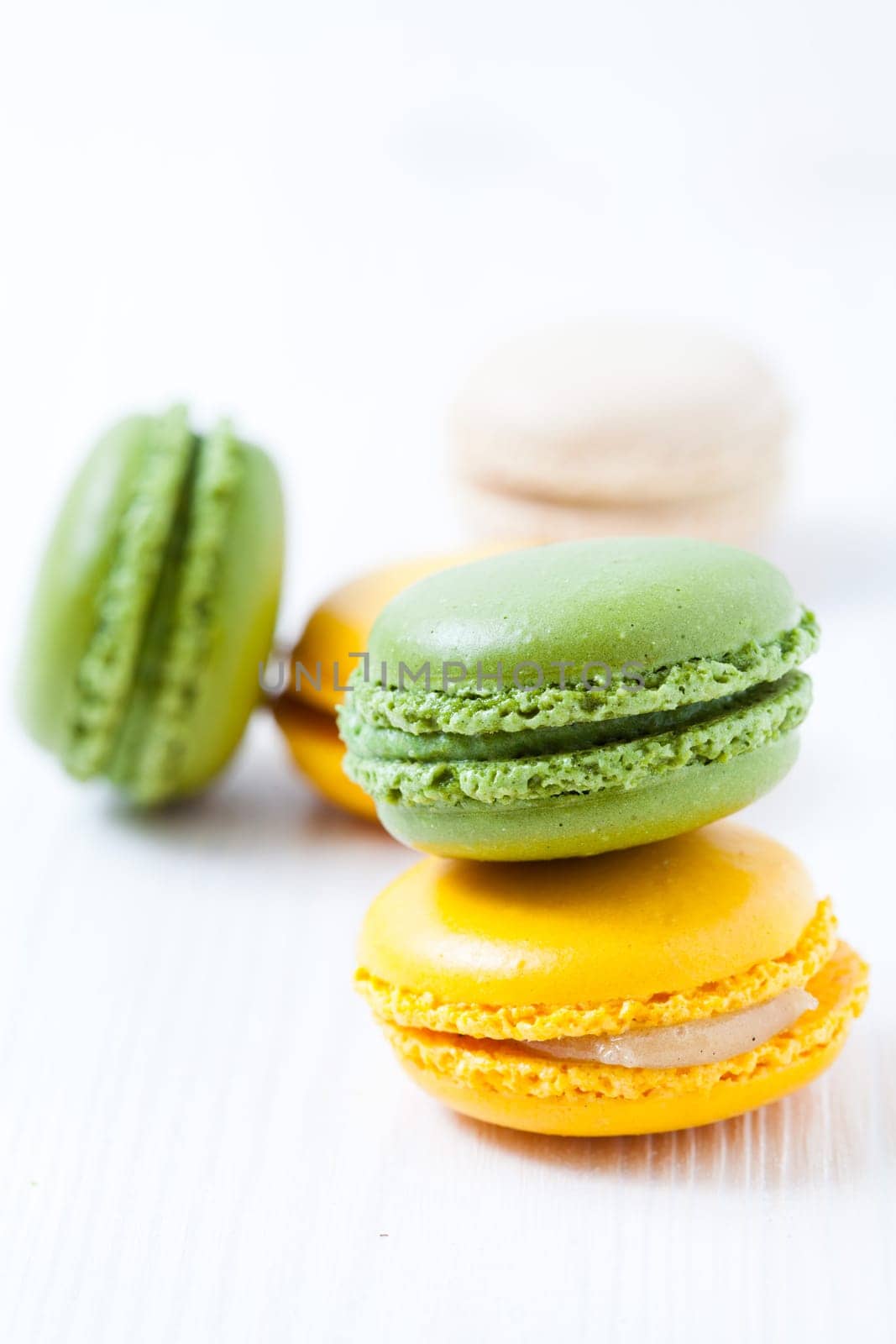 Close-up of colorful macaroons on light background