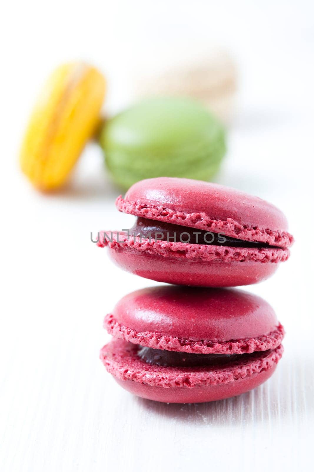 Close-up of colorful macaroons on light background
