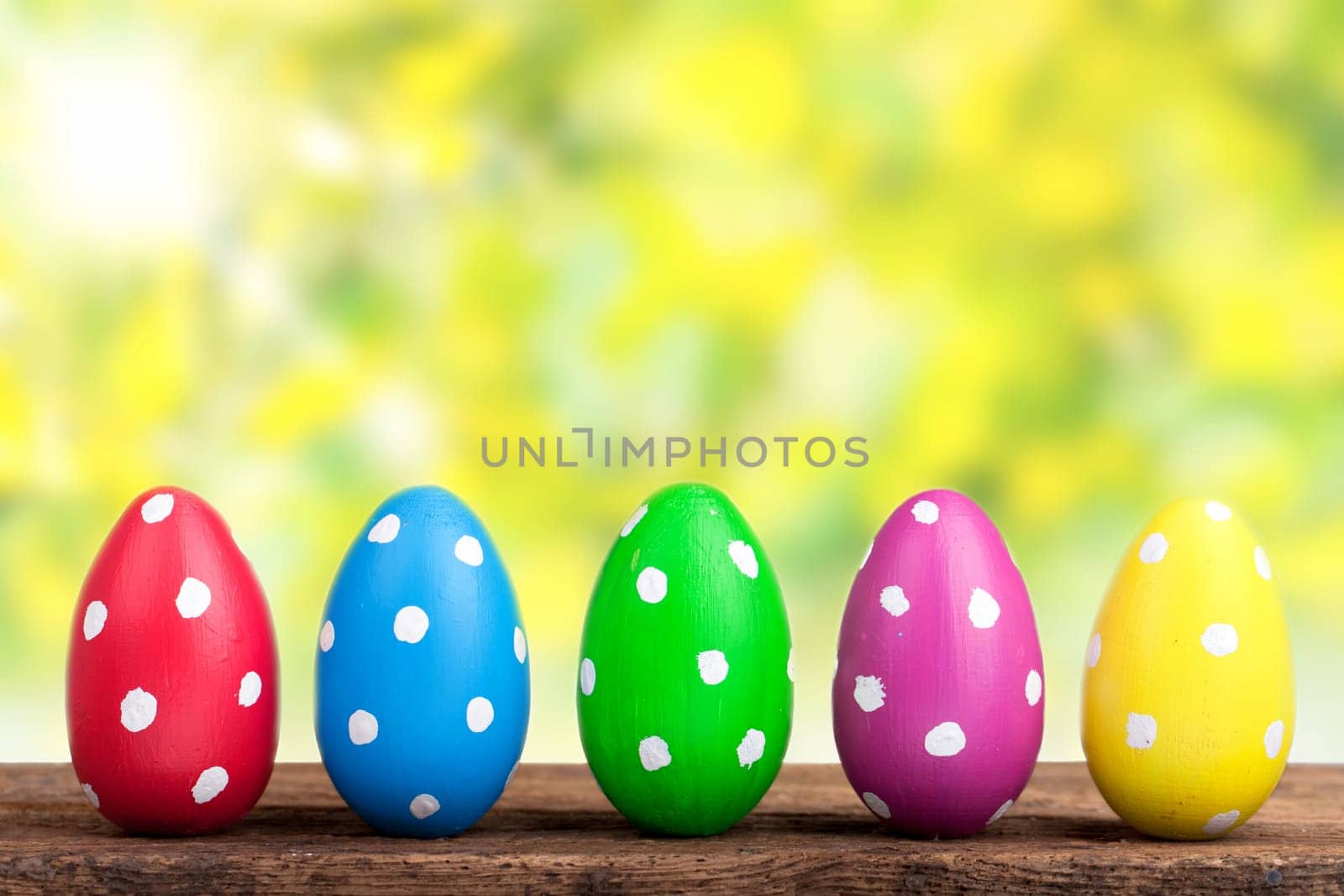 Colorful Easter eggs against natural background