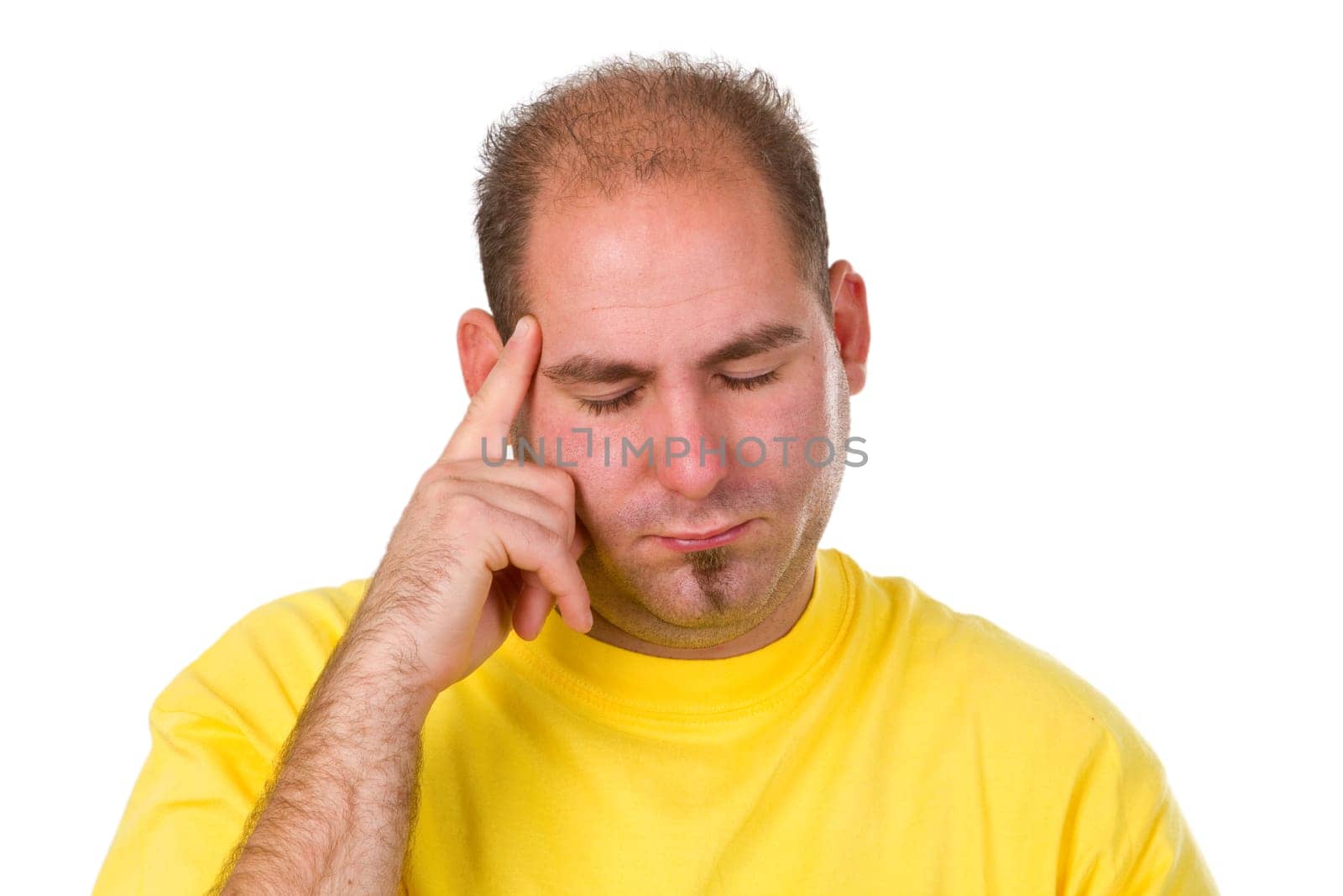 Young pensive man isolated on white background