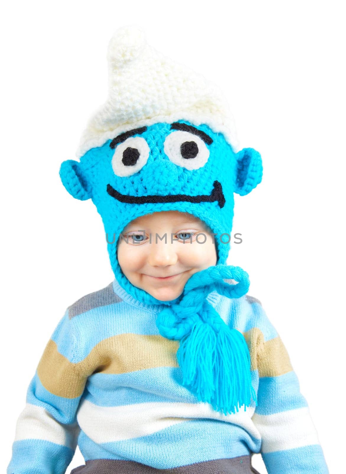 Portrait of 1 year old baby boy with funny hat, studio shot.