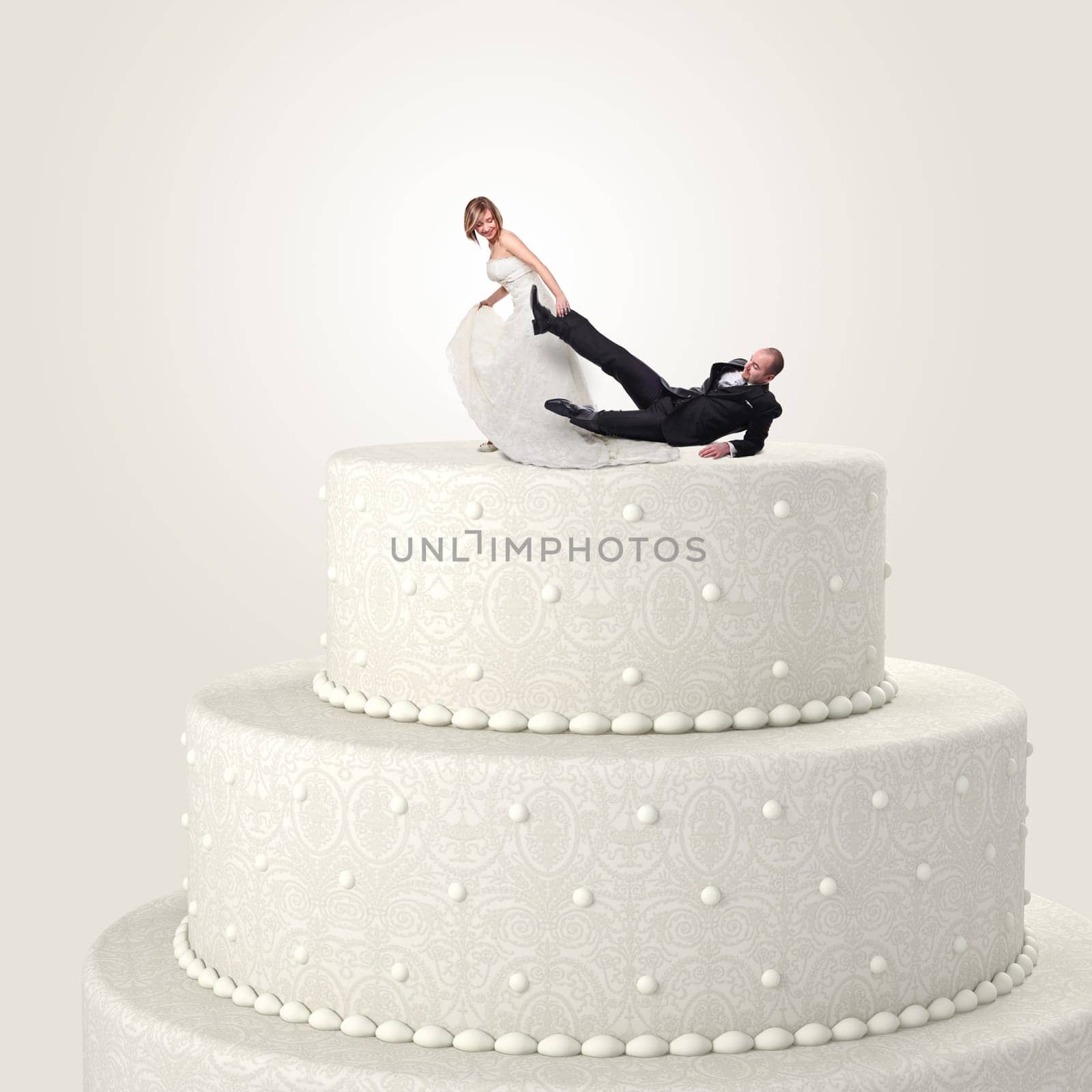 funny groom and bride on cake top