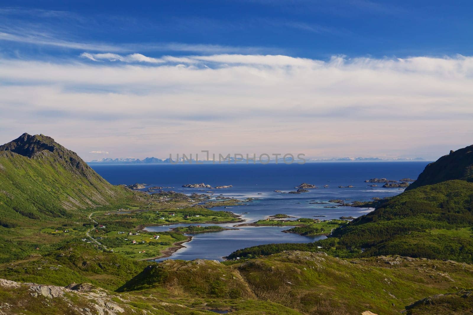 Scenic panorama of fjord with islands and picturesque fishing villages on Lofoten islands in Norway