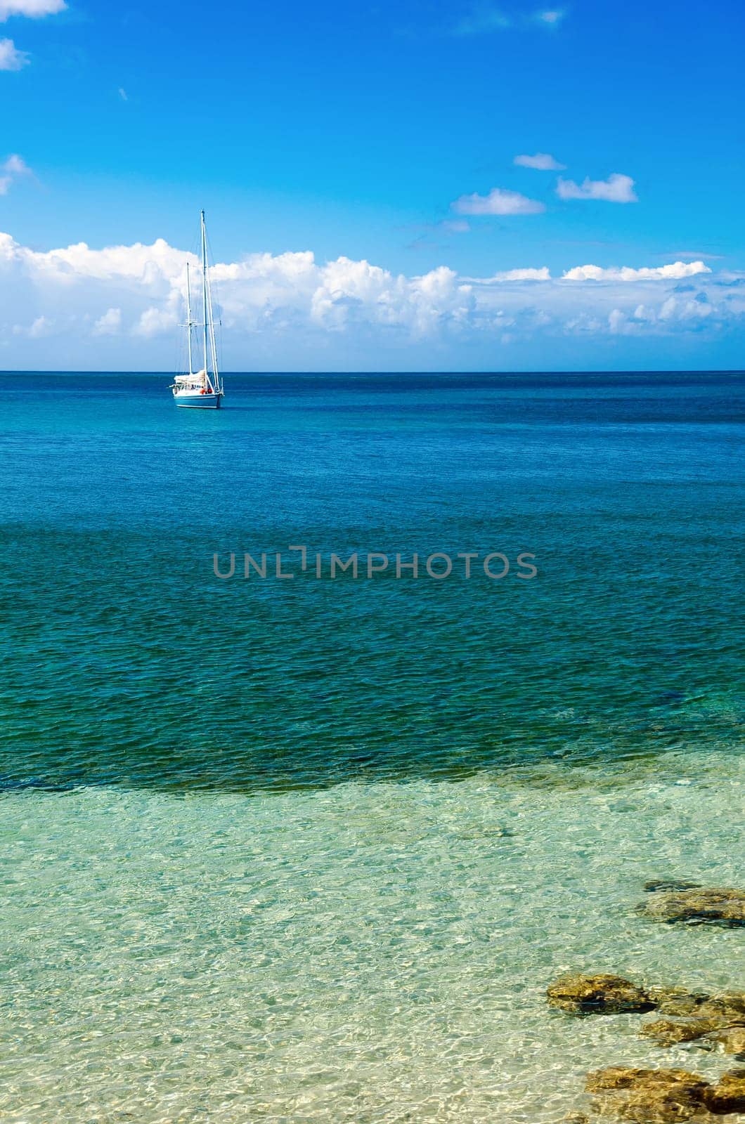 A yacht in beautiful blue Caribbean water in San Andres y Providencia, Colombia