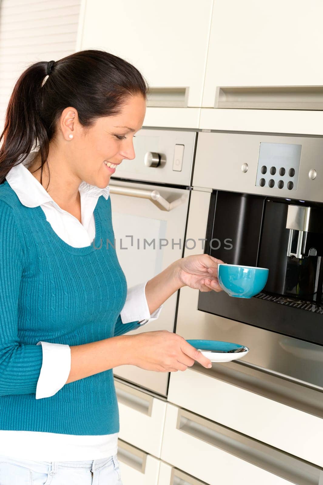 Cheerful woman making coffee machine kitchen cup preparing