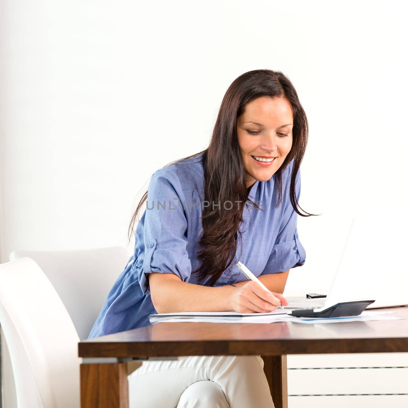 Smiling woman researching library university exam writing essay