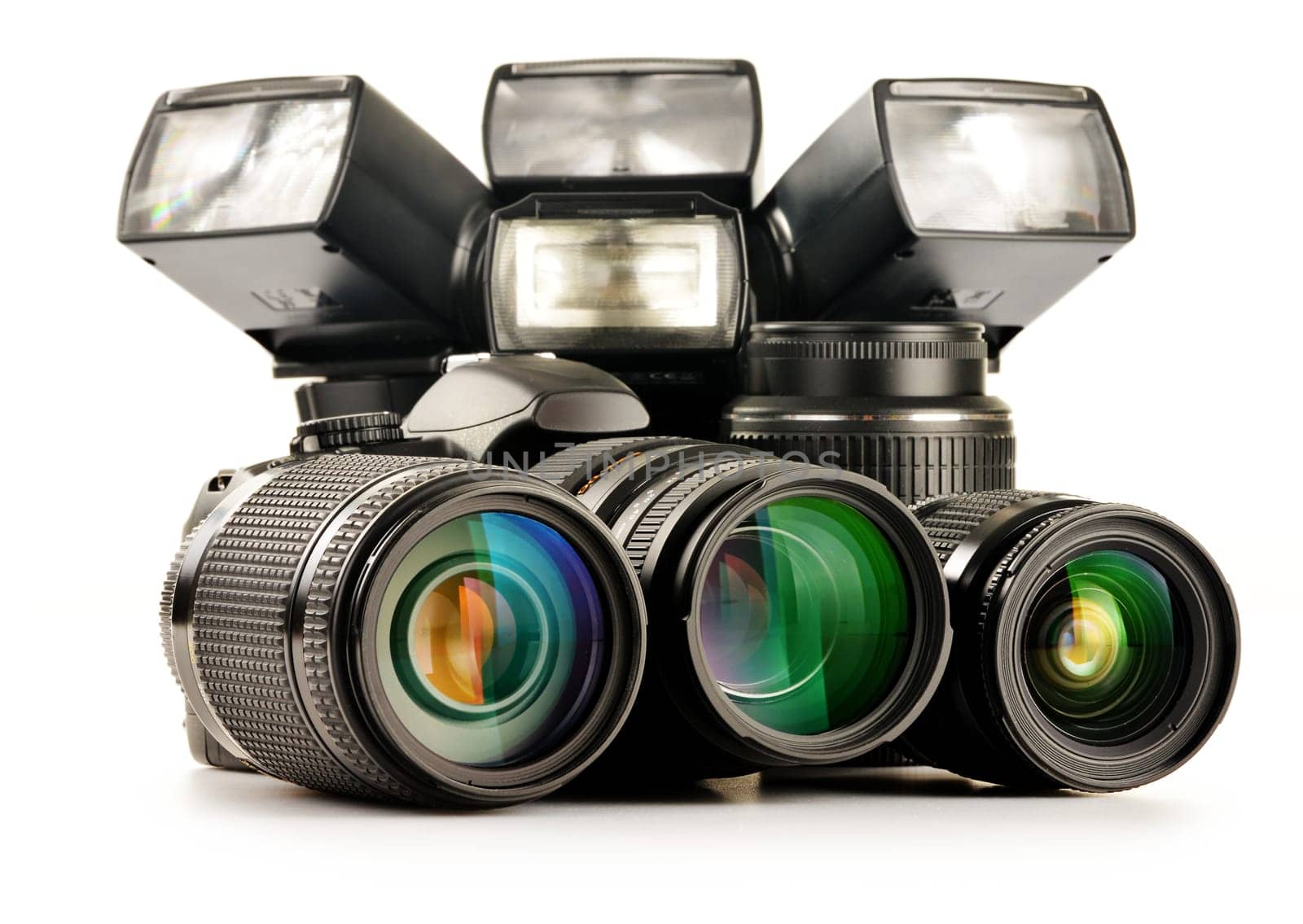 Composition with photo equipment including zoom lenses, camera and flash lights isolated on white