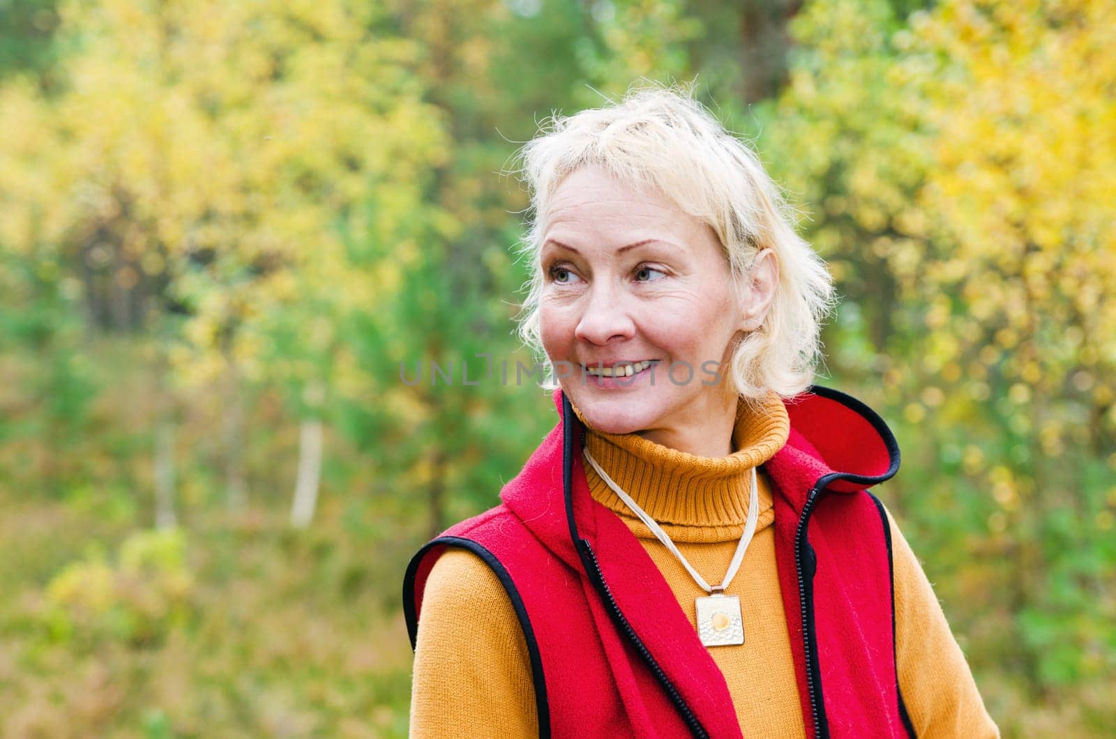 Portrait of a woman middle aged outdoors in fall