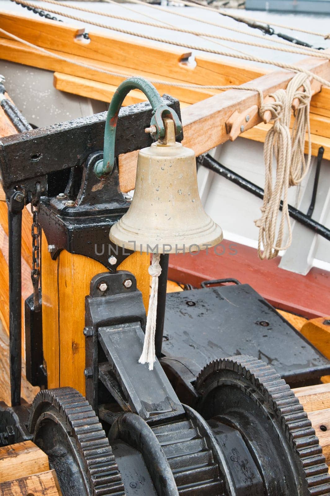 ship's Bell and anchor lifting mechanism on an old sailboat