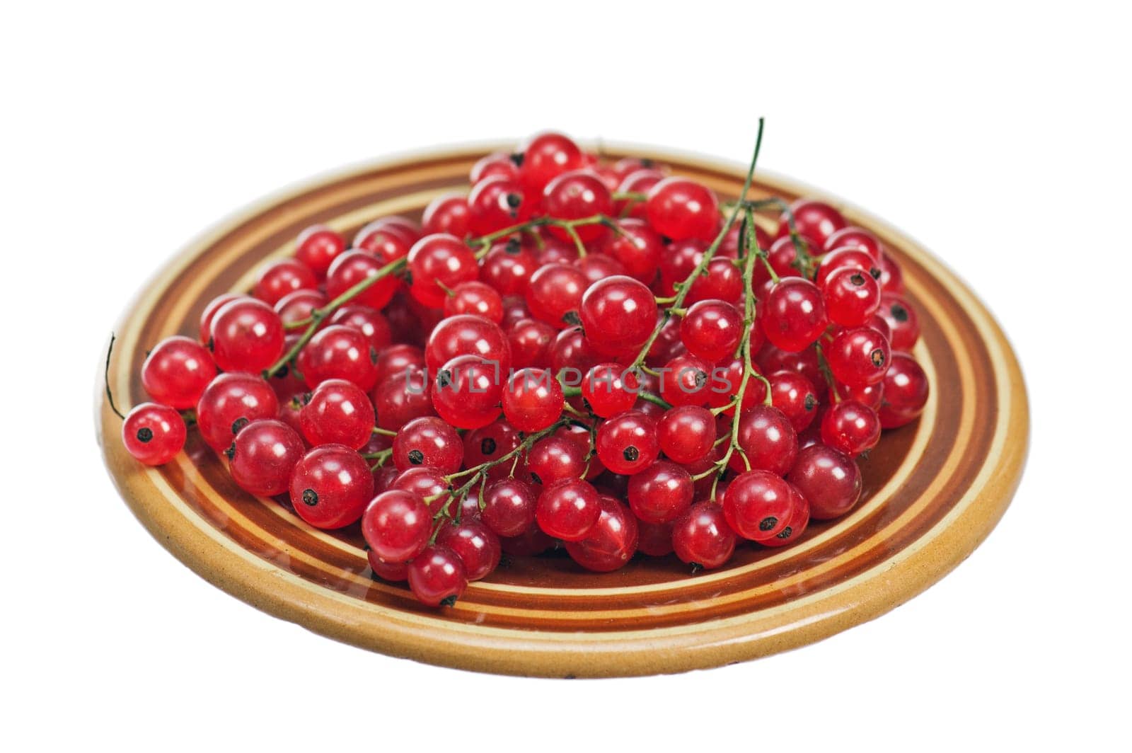 Berries of a red currant in a plate, isolated on white