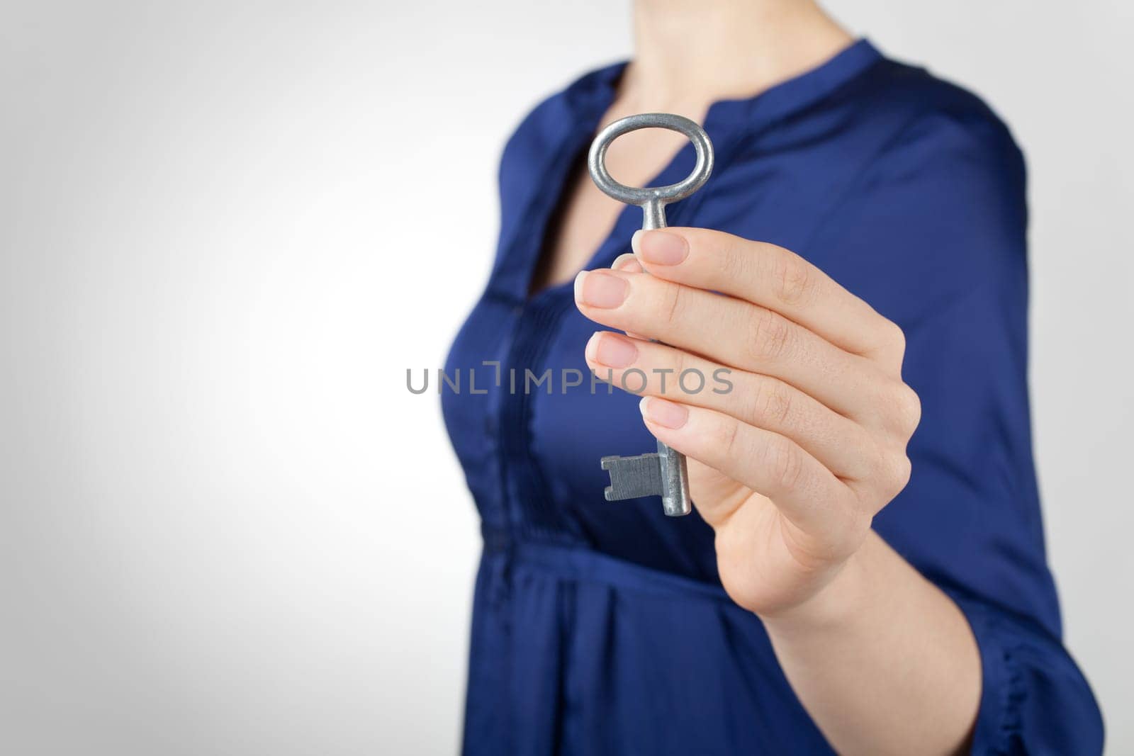 Woman offer old style key