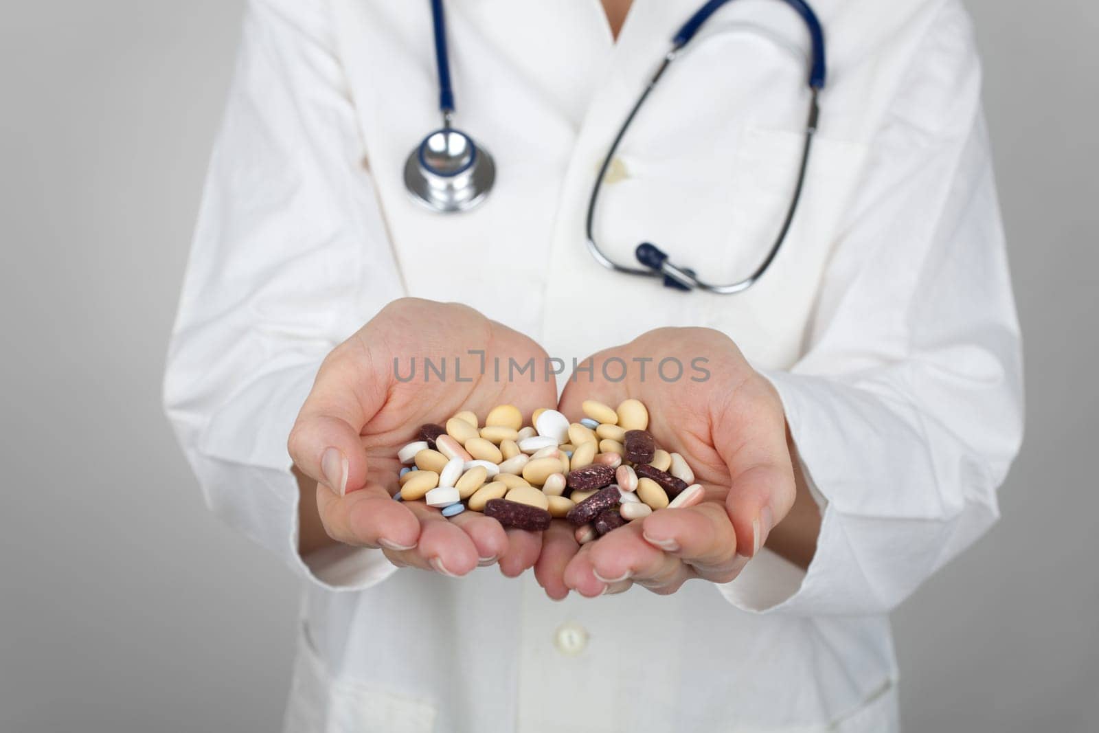 Doctor with a handful of drugs.