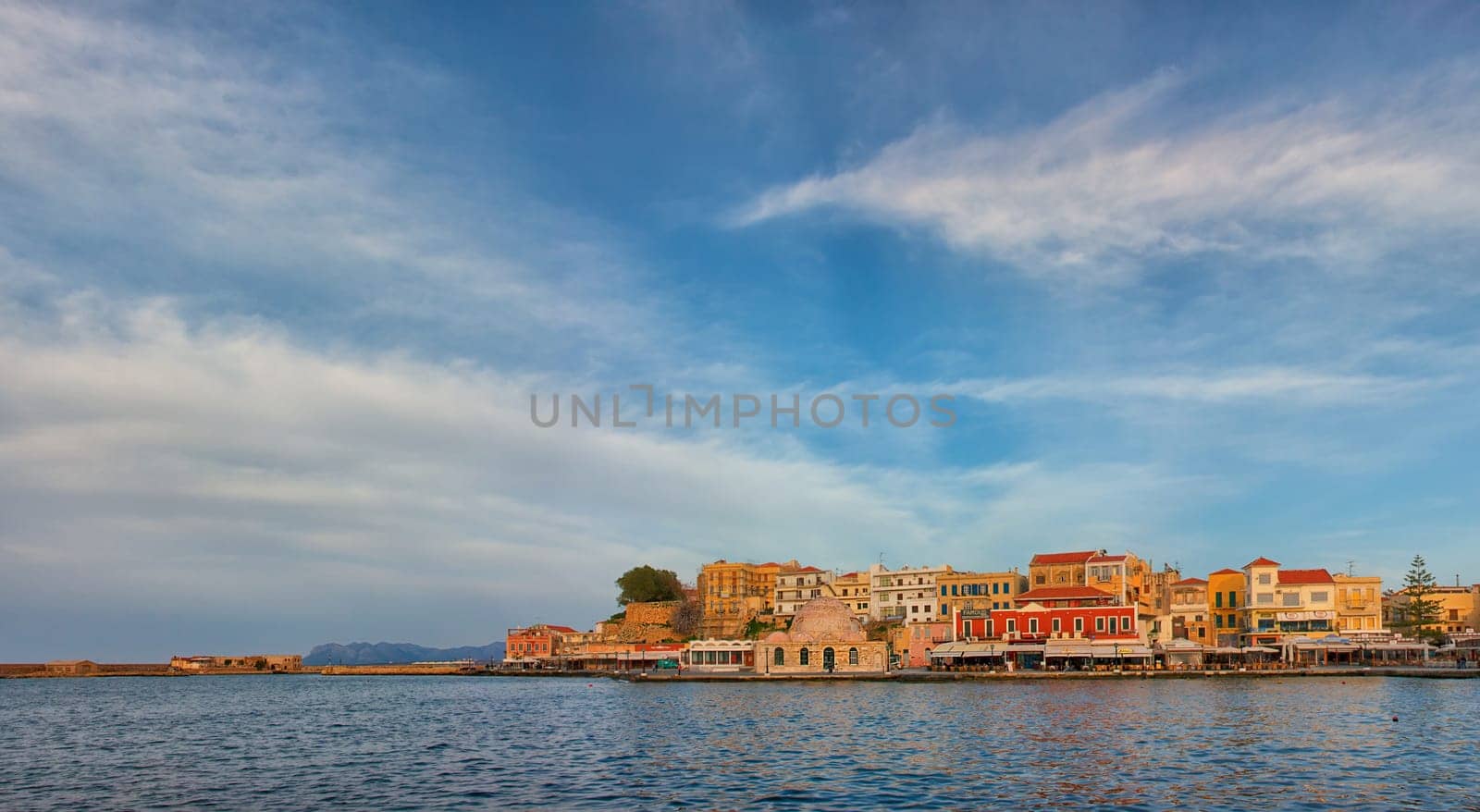 CHANIA, GREECE - MARCH 3: The old Venetian harbour at sunset on March 3, 2010 in Chania, Crete Island, Greece.