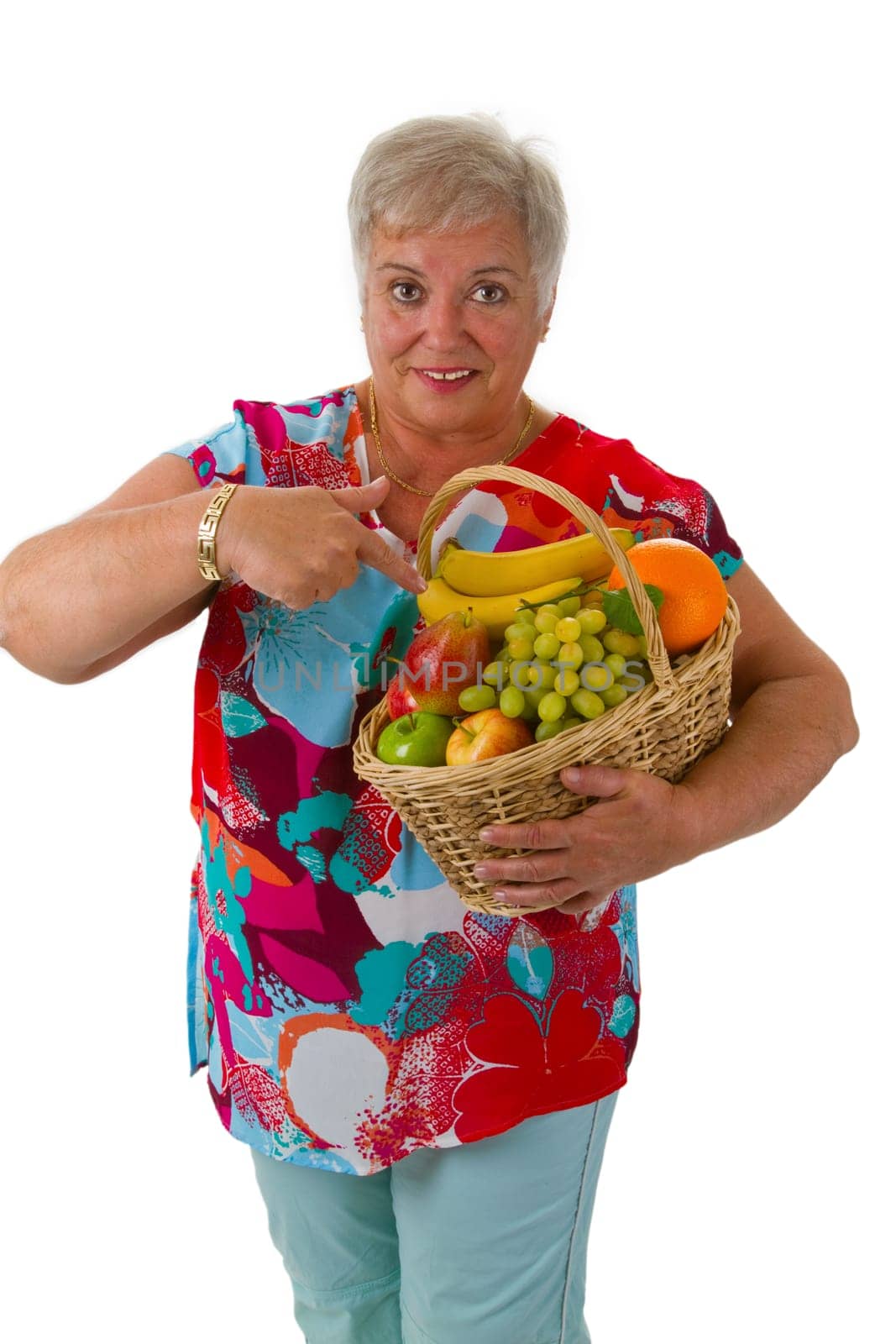 Senior woman with fresh fruit isolated on white background