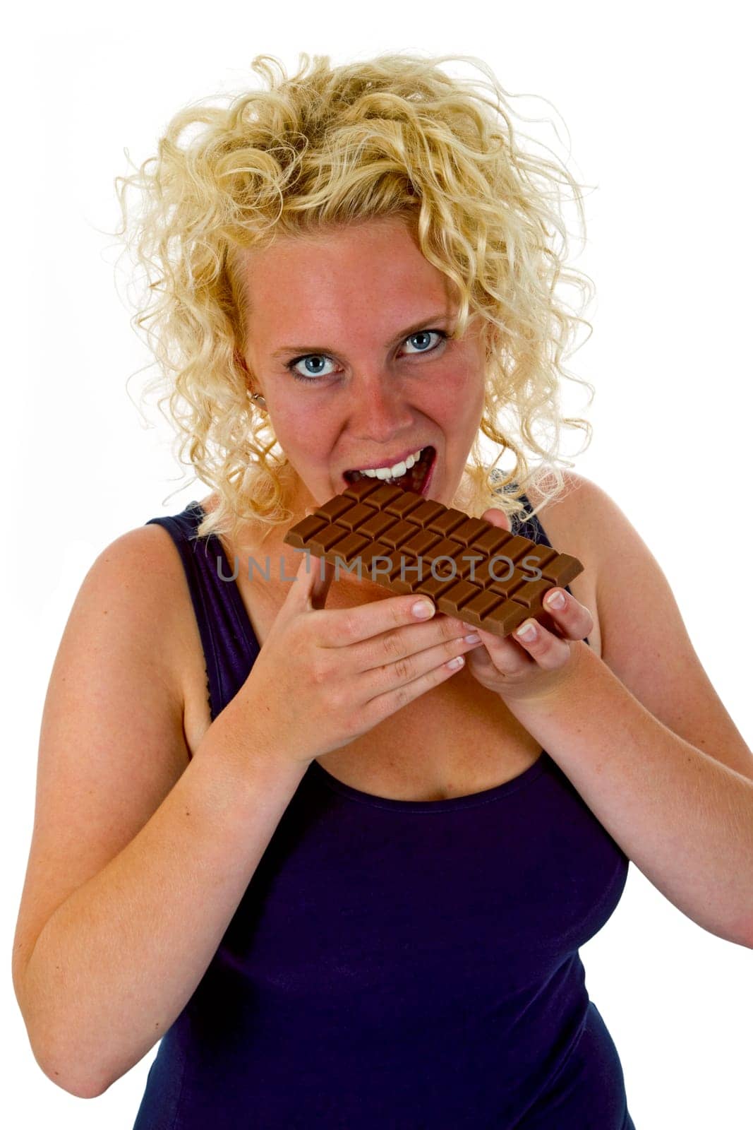Young woman eating chocolate bar isolated on white background