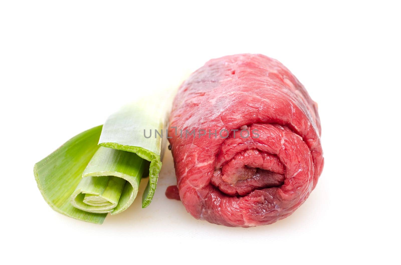 Raw beef roulade and green leeks