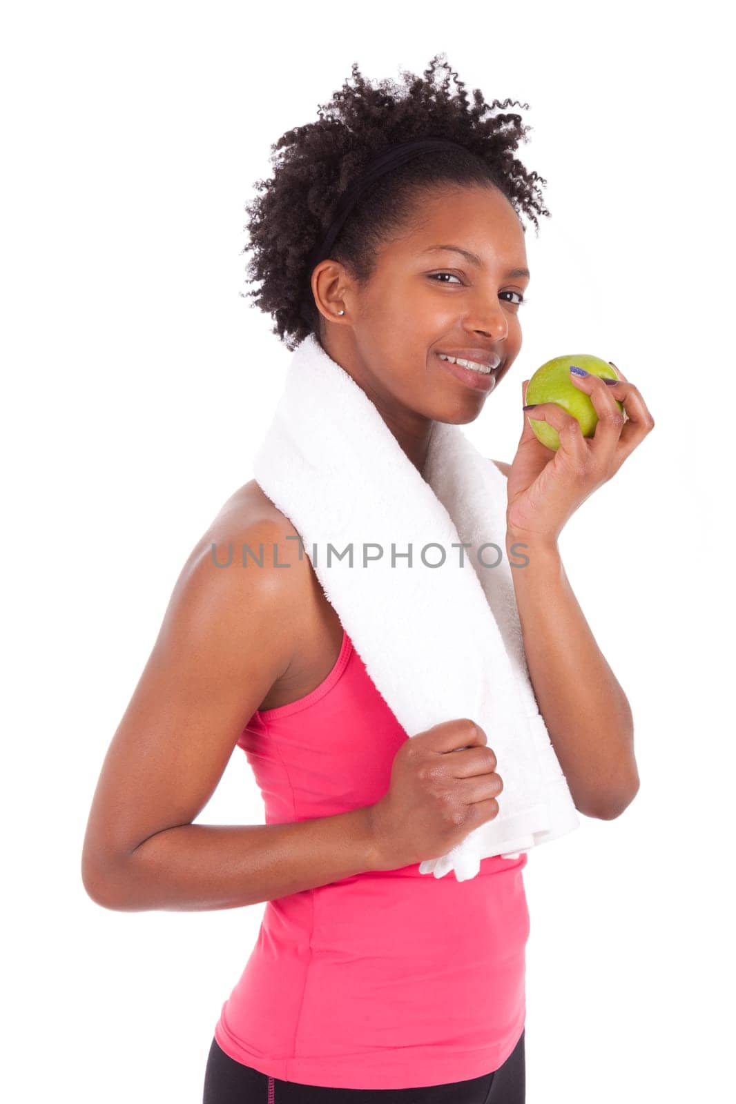 Young african american woman eating  an apple over white background