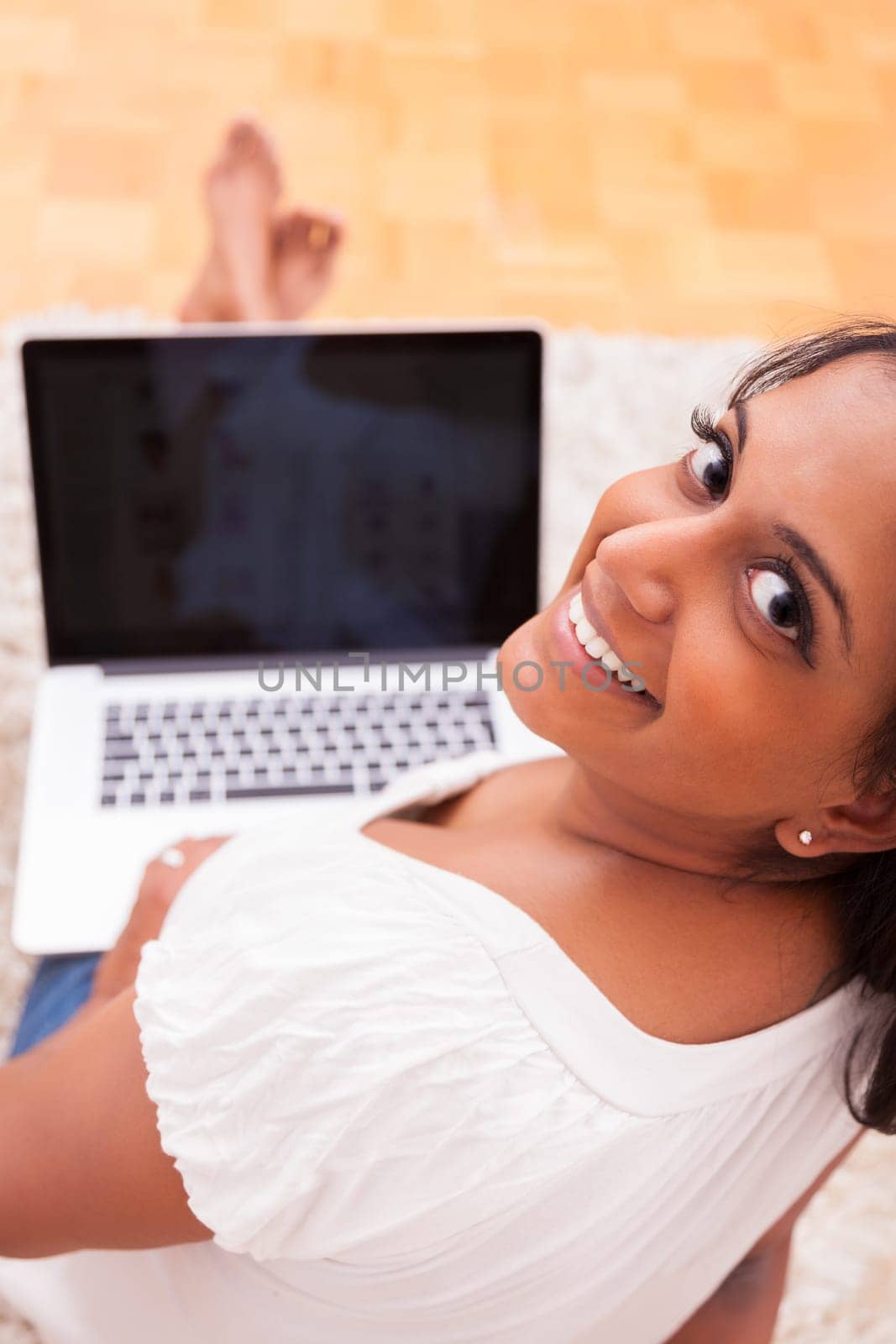 Young beautiful indian woman using a laptop