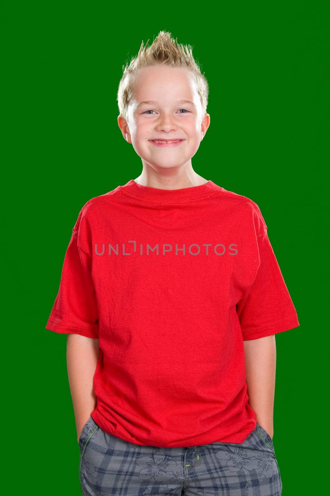 happy boy in front of green background