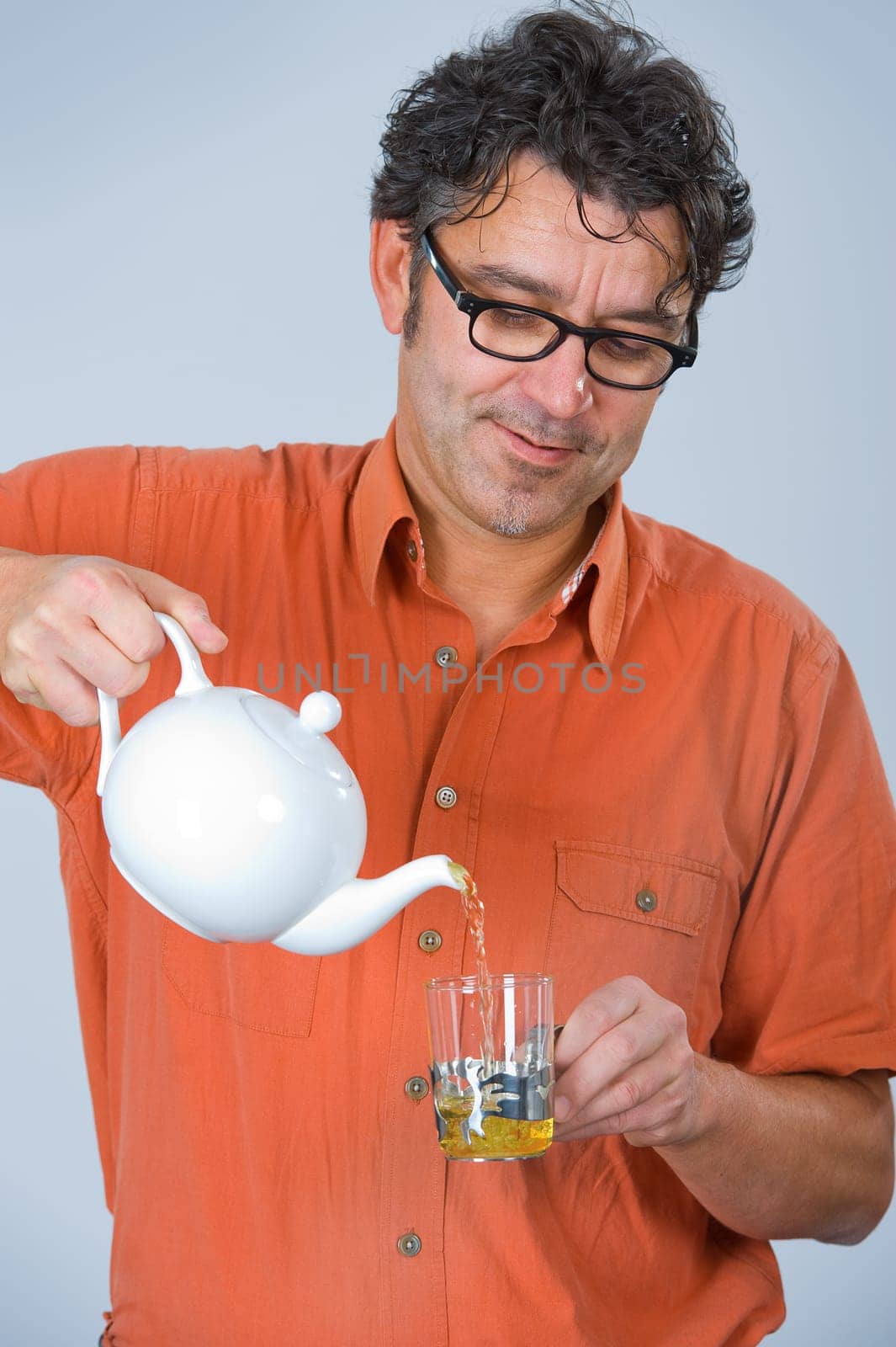 man is drinking tea