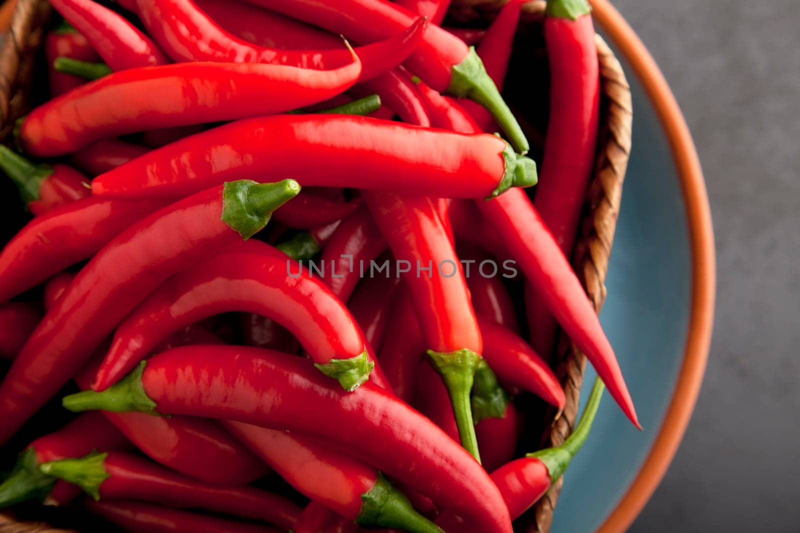 Basket full of raw hot chili peppers.