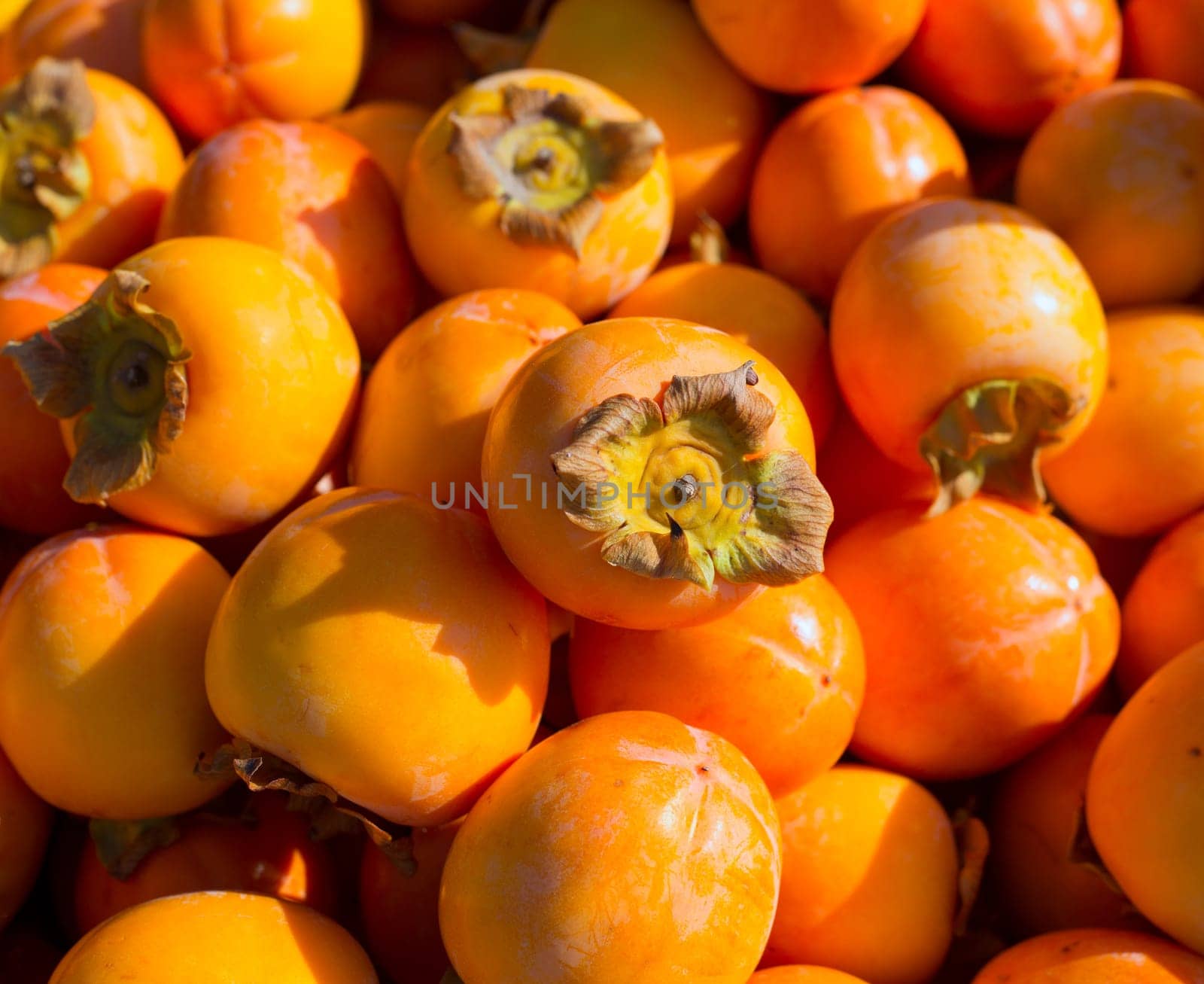 Persimmon ripe fruits pattern in market display