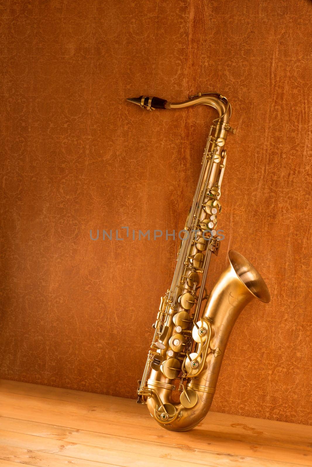 Sax golden tenor saxophone in vintage retro background