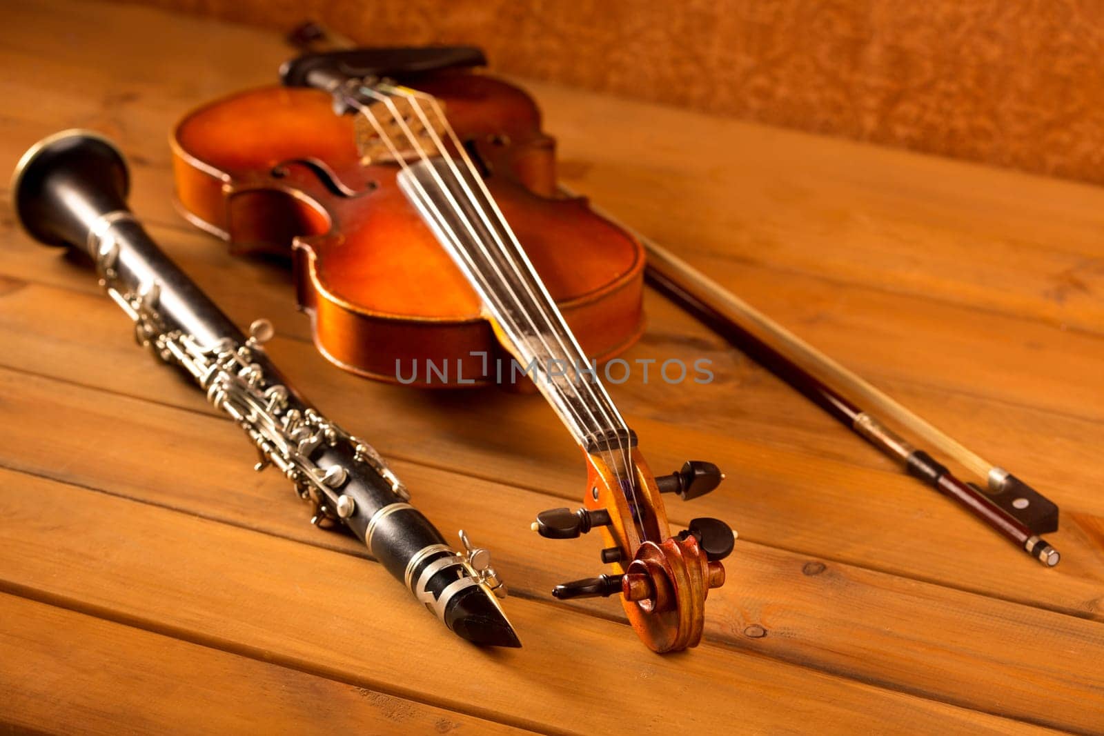 Classic music violin and clarinet in vintage wood background