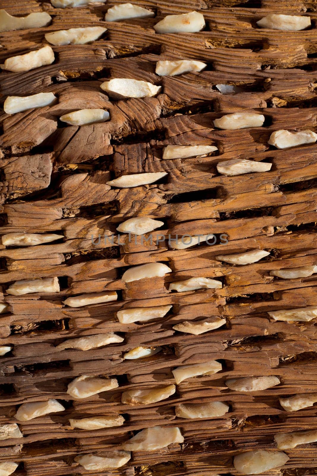 threshing board for wheat of aged wood and stones texture vintage pattern
