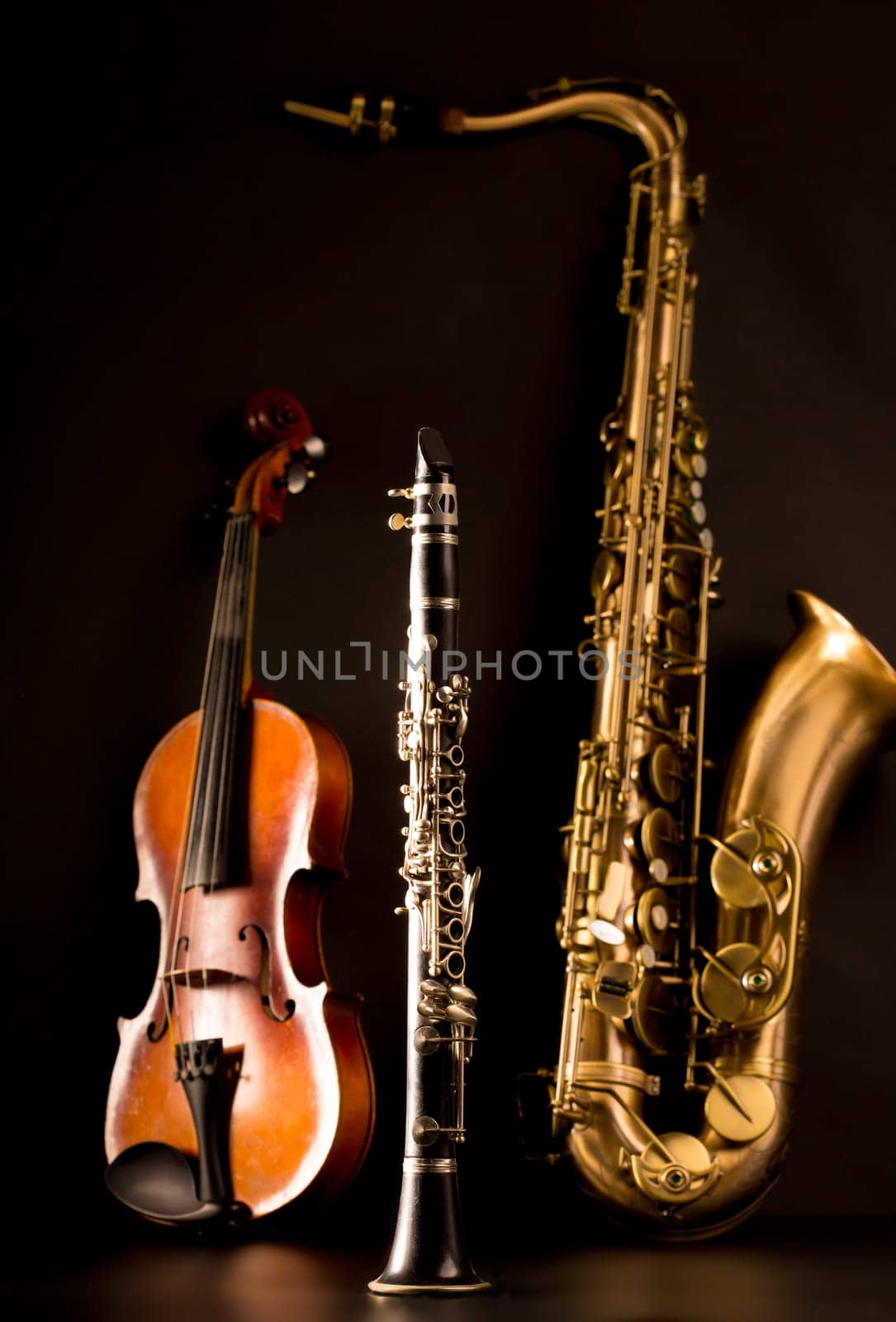Music Sax tenor saxophone violin and clarinet in black background