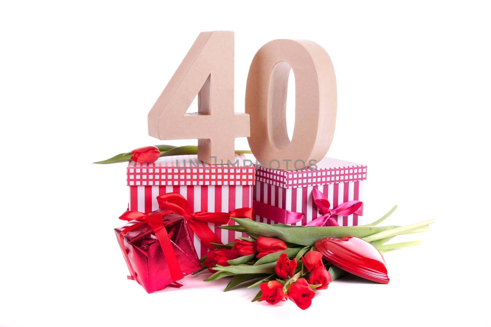 Number of age in a colorful studio setting with a red heart and gifts and tulips