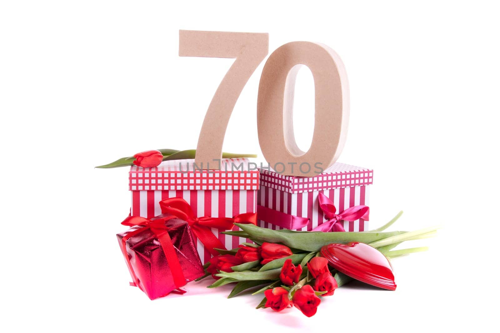 Number of age in a colorful studio setting with a red heart and gifts and tulips