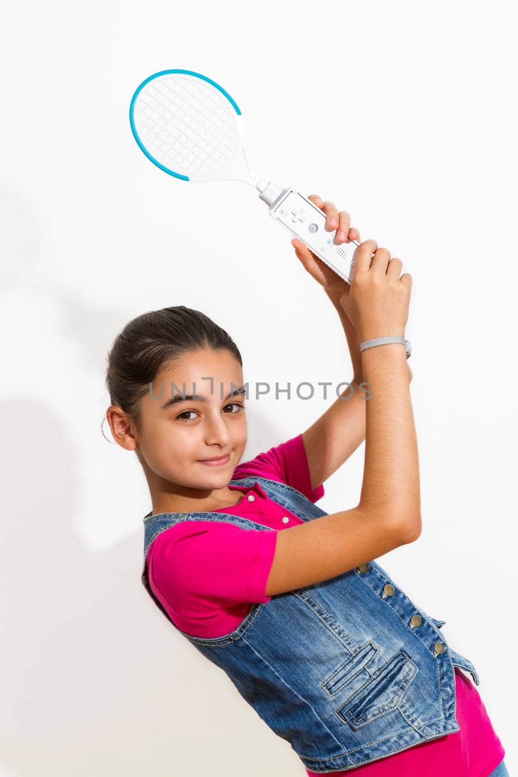 A teenage girl playing video game, isolated on white background