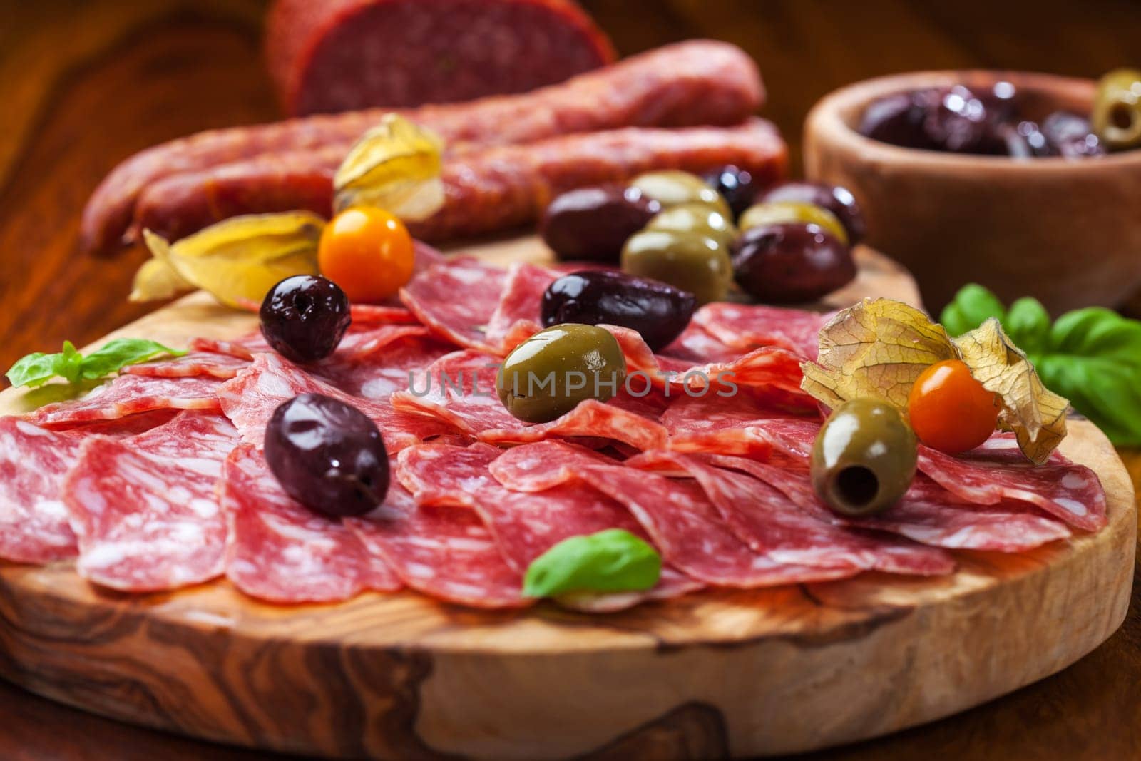 Italian salami with olives and herbs