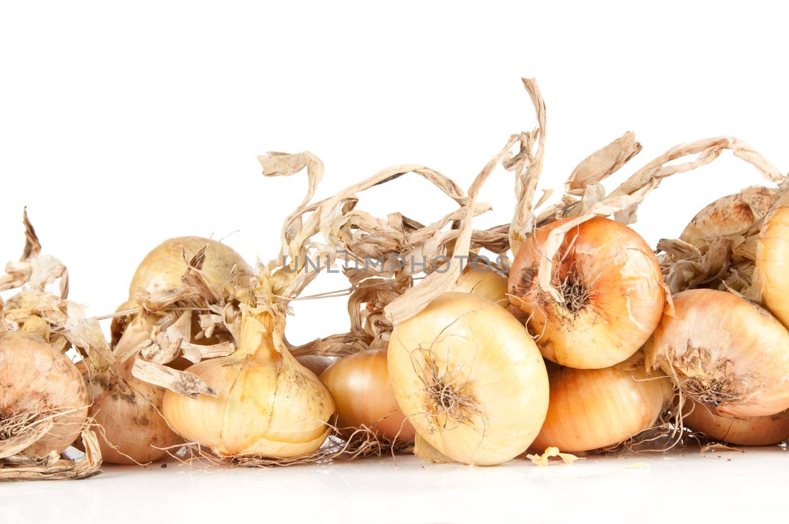 Lot of onions isolated on white background