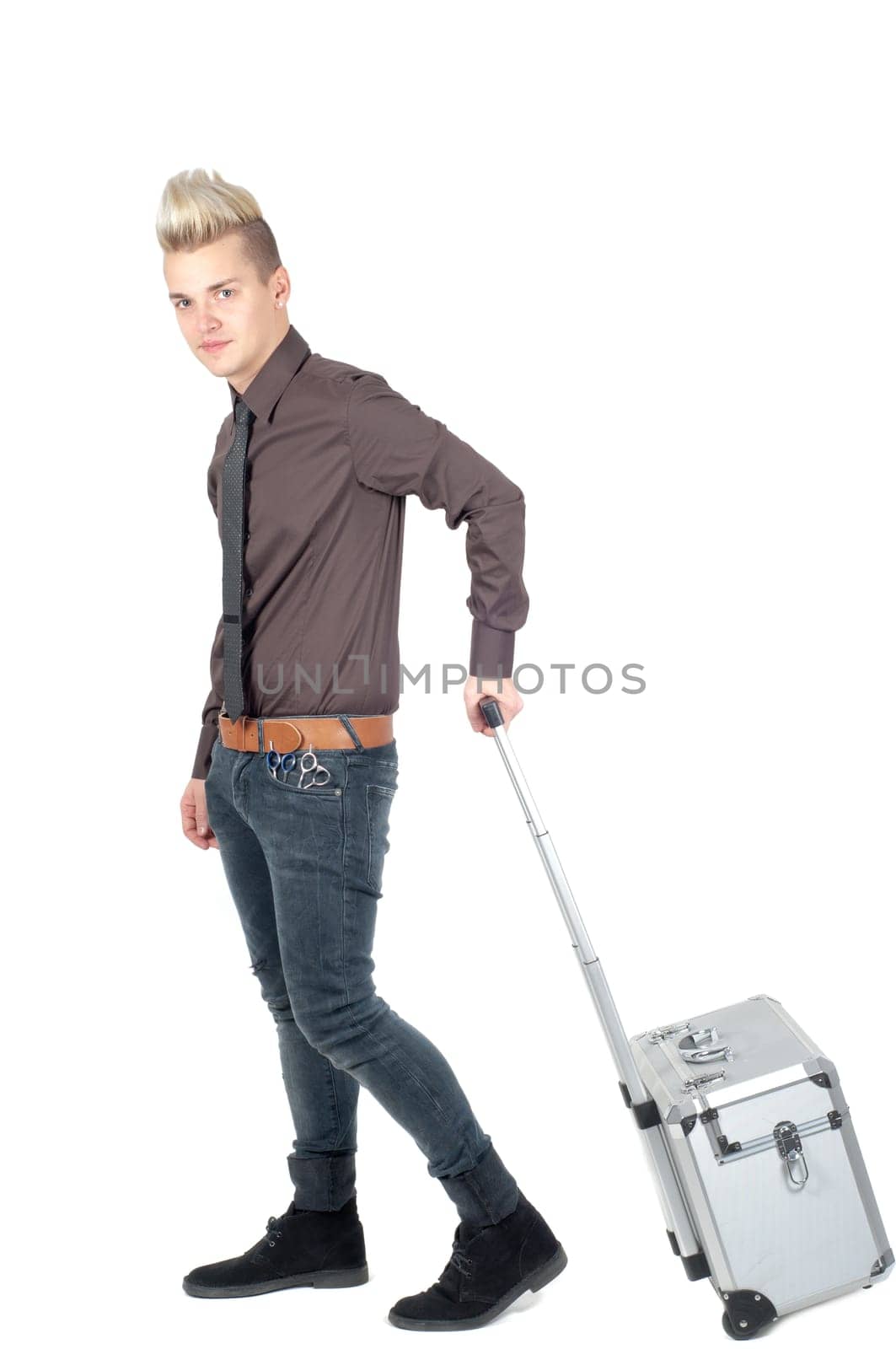 Portrait of handsome man with big bag in studio isolated on white