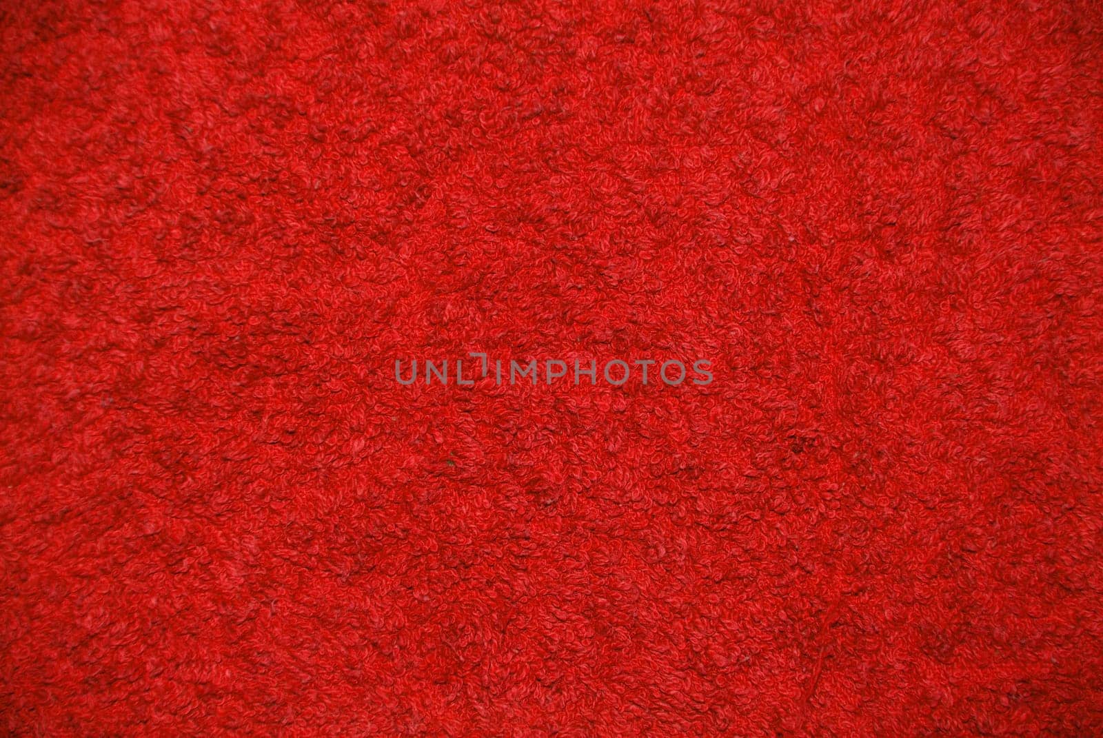 a red background with a structure of a towel