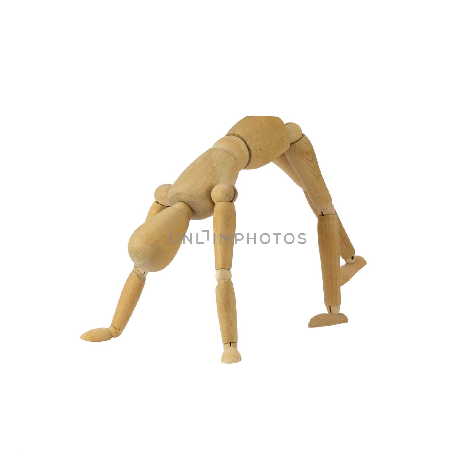 Wooden female figure is doing handstand
