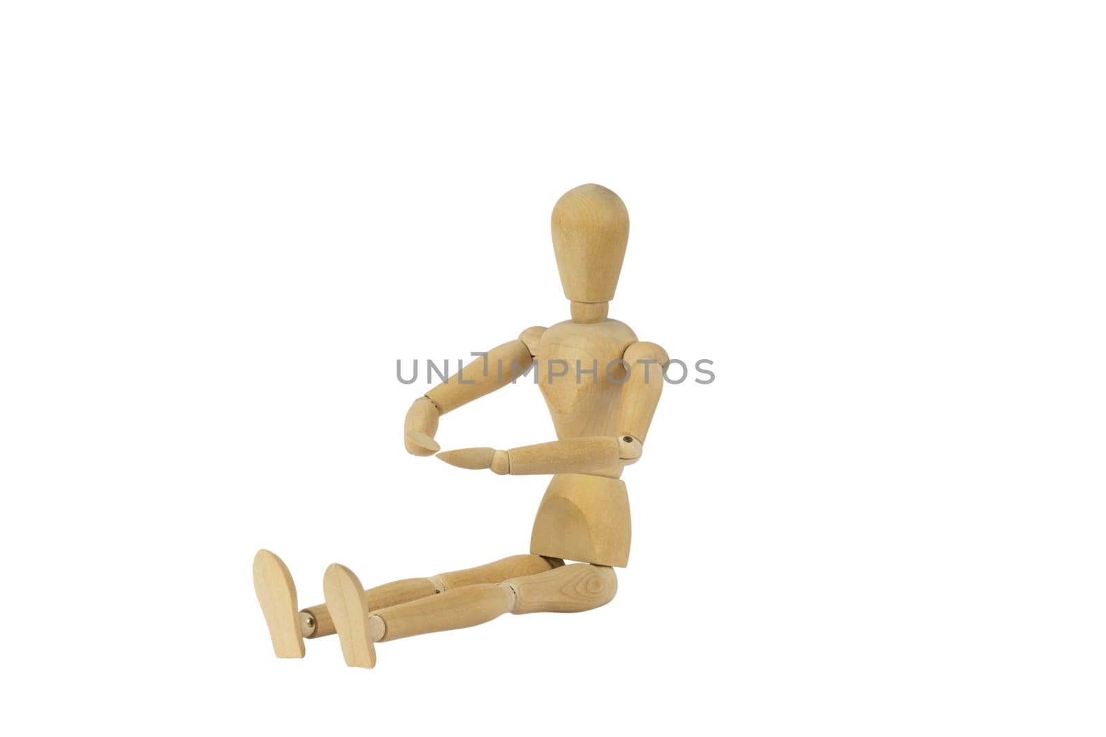 A wooden female doll sitting and looking on her palms