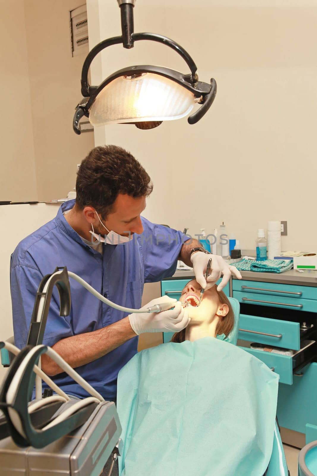 Blonde girl in chair at dentist office