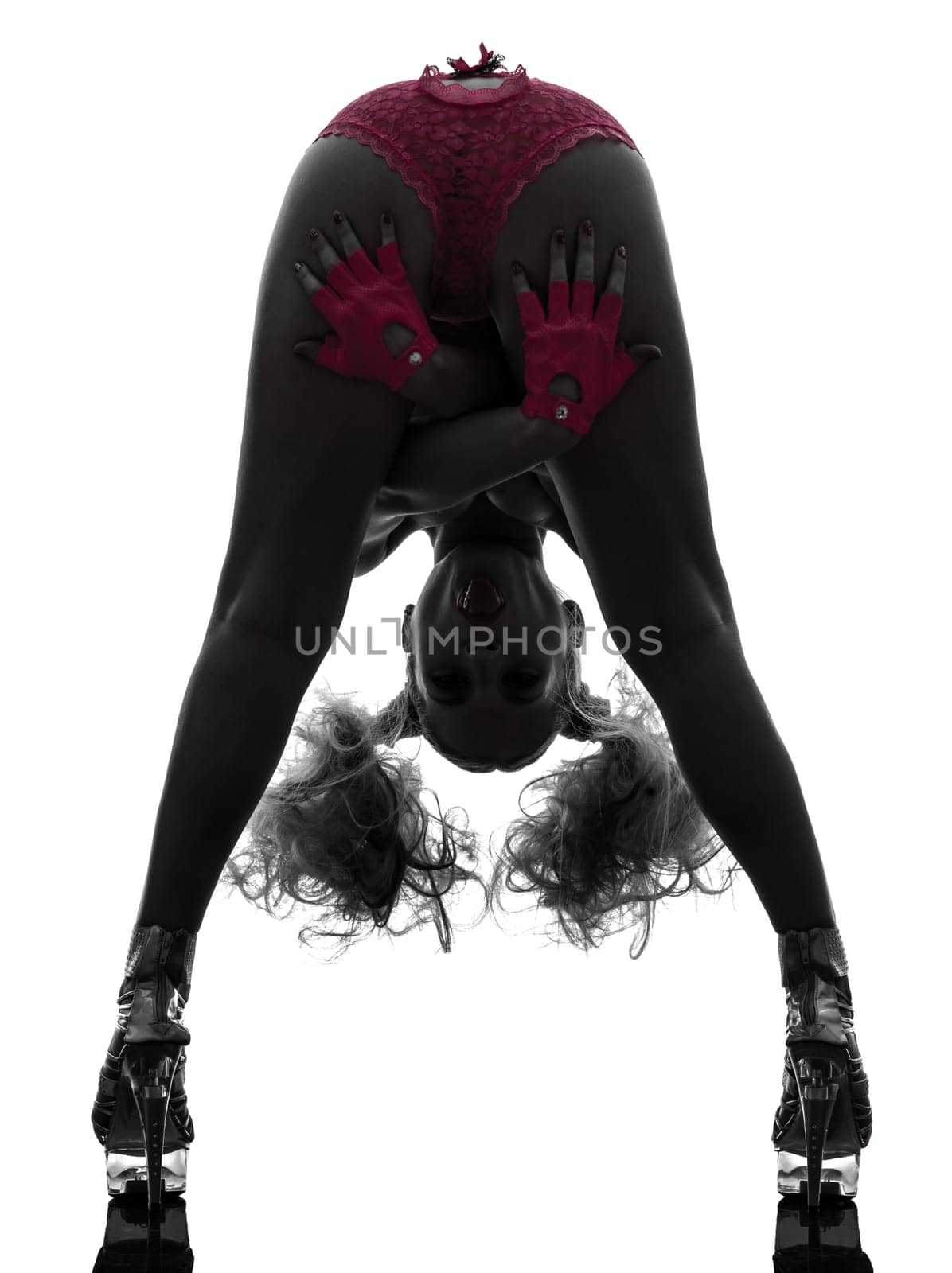 one caucasian sexy woman topless with pink underwear tongue out in silhouette studio isolated on white background