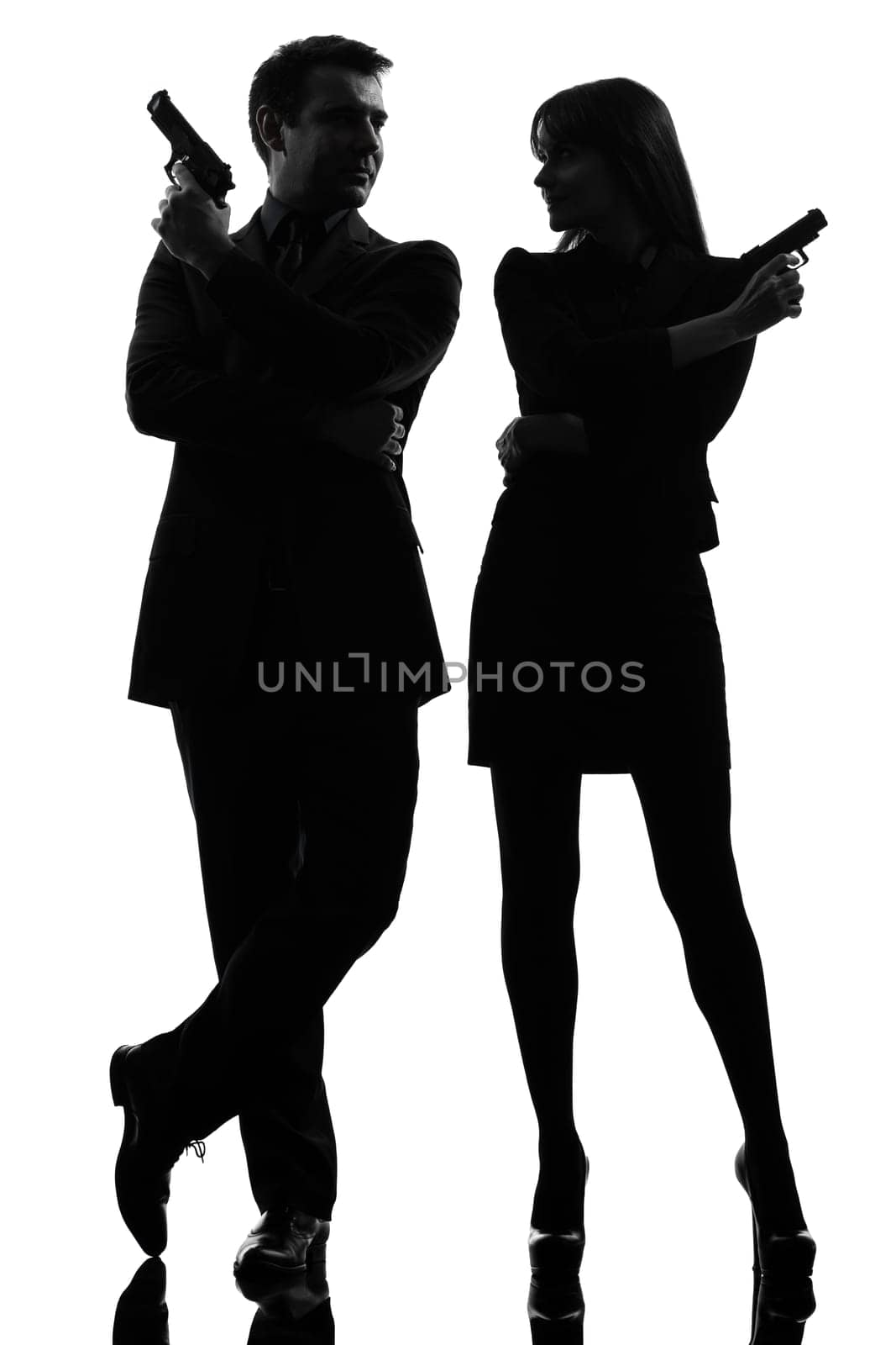 one caucasian man detective secret agent criminal  with gun  in silhouette studio isolated on white background