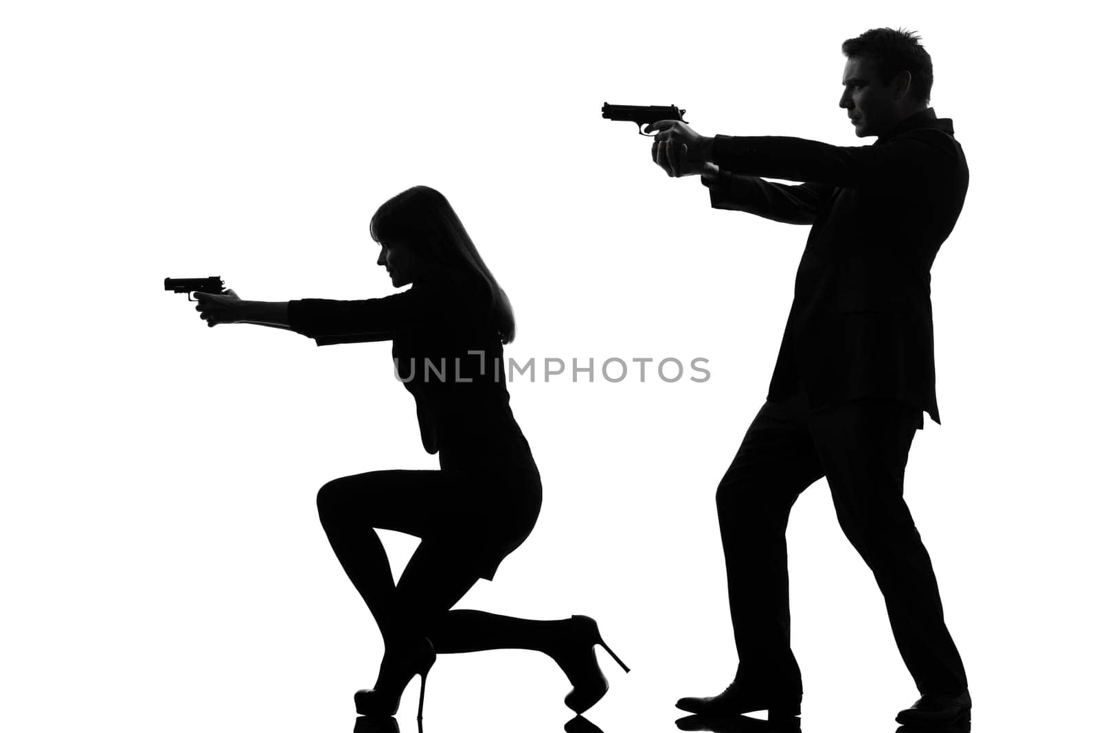 one caucasian man detective secret agent criminal  with gun  in silhouette studio isolated on white background