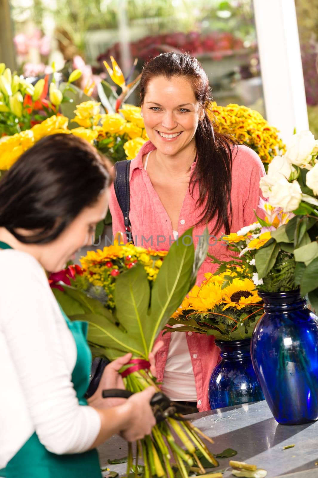 Cheerful woman buying bouquet flower shop florist cutting market