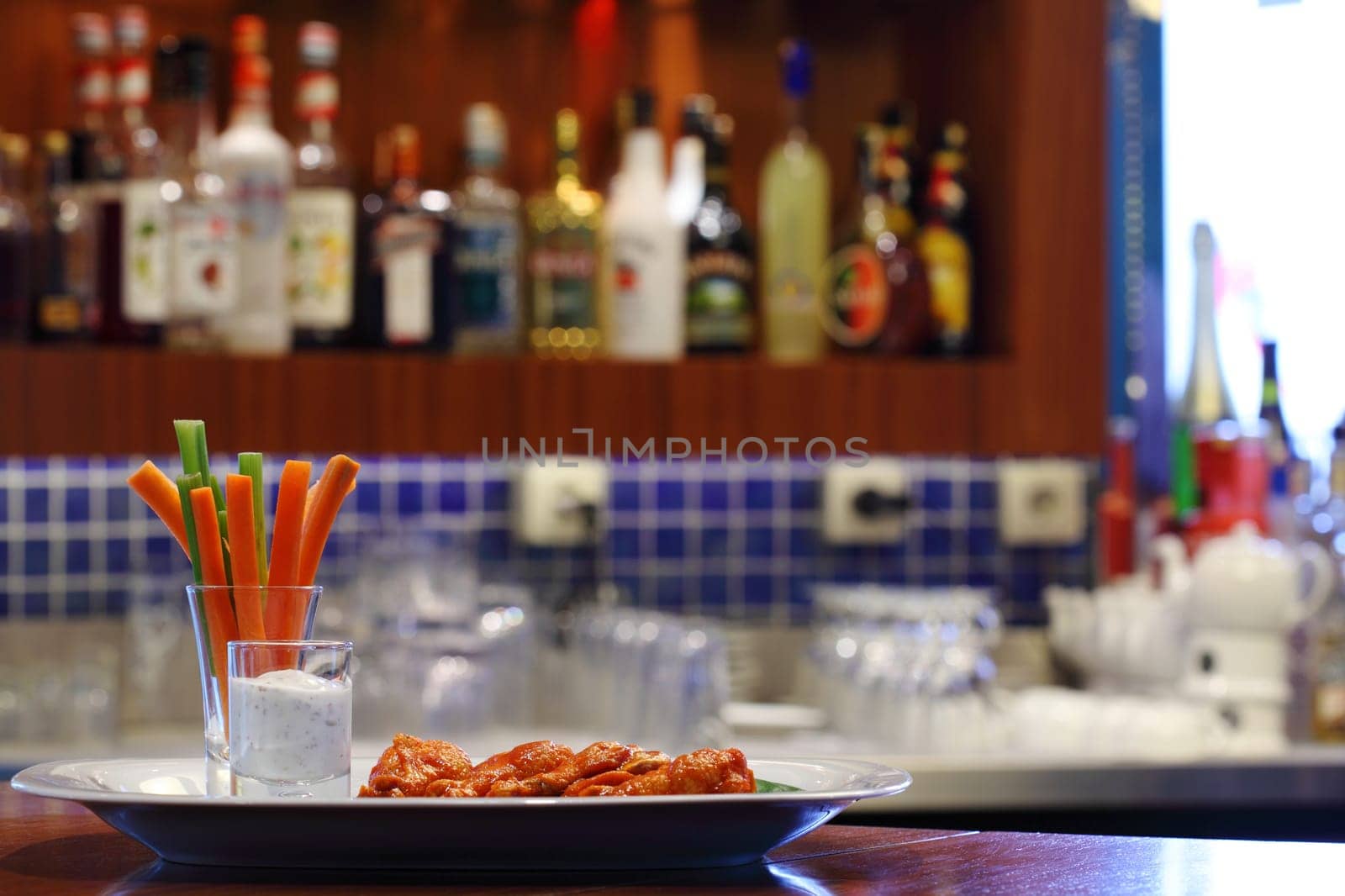 Buffalo chicken served in pub desk