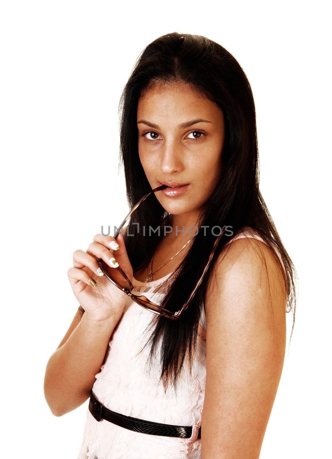A portrait shot of a young teenager girl with long black hair and a sunglasses  in her mouths, for white background.
