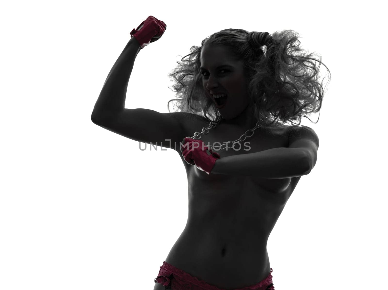 one caucasian sexy woman laughing topless with pink underwear in silhouette studio isolated on white background