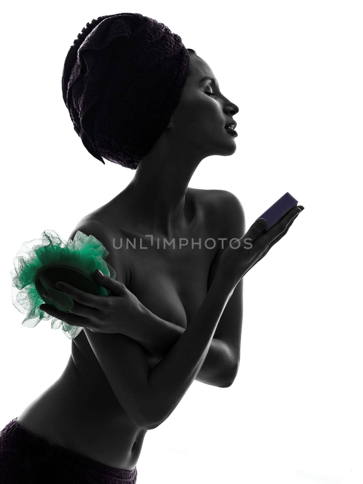 one beautiful asian young woman portrait holding washing accessories wrapped towel in silhouette studio isolated on white background