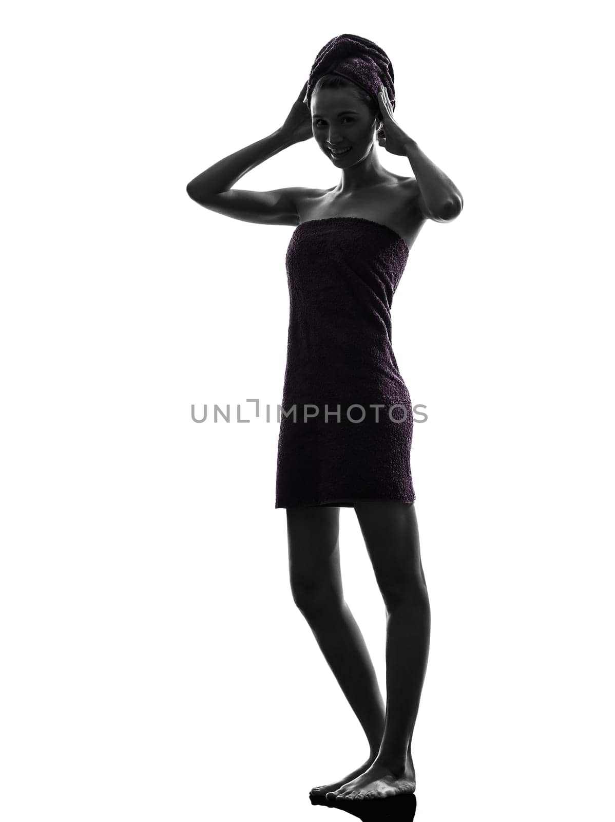 one beautiful asian young woman wrapped towel in silhouette studio isolated on white background