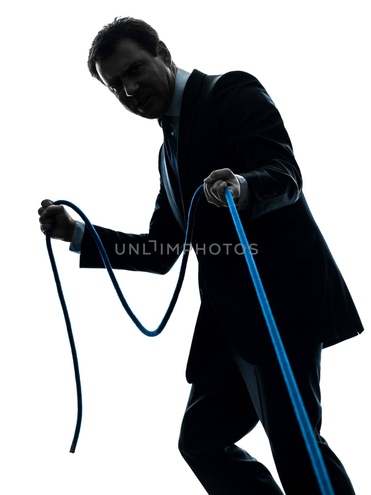 one caucasian business man pulling a rope in silhouette studio isolated on white background